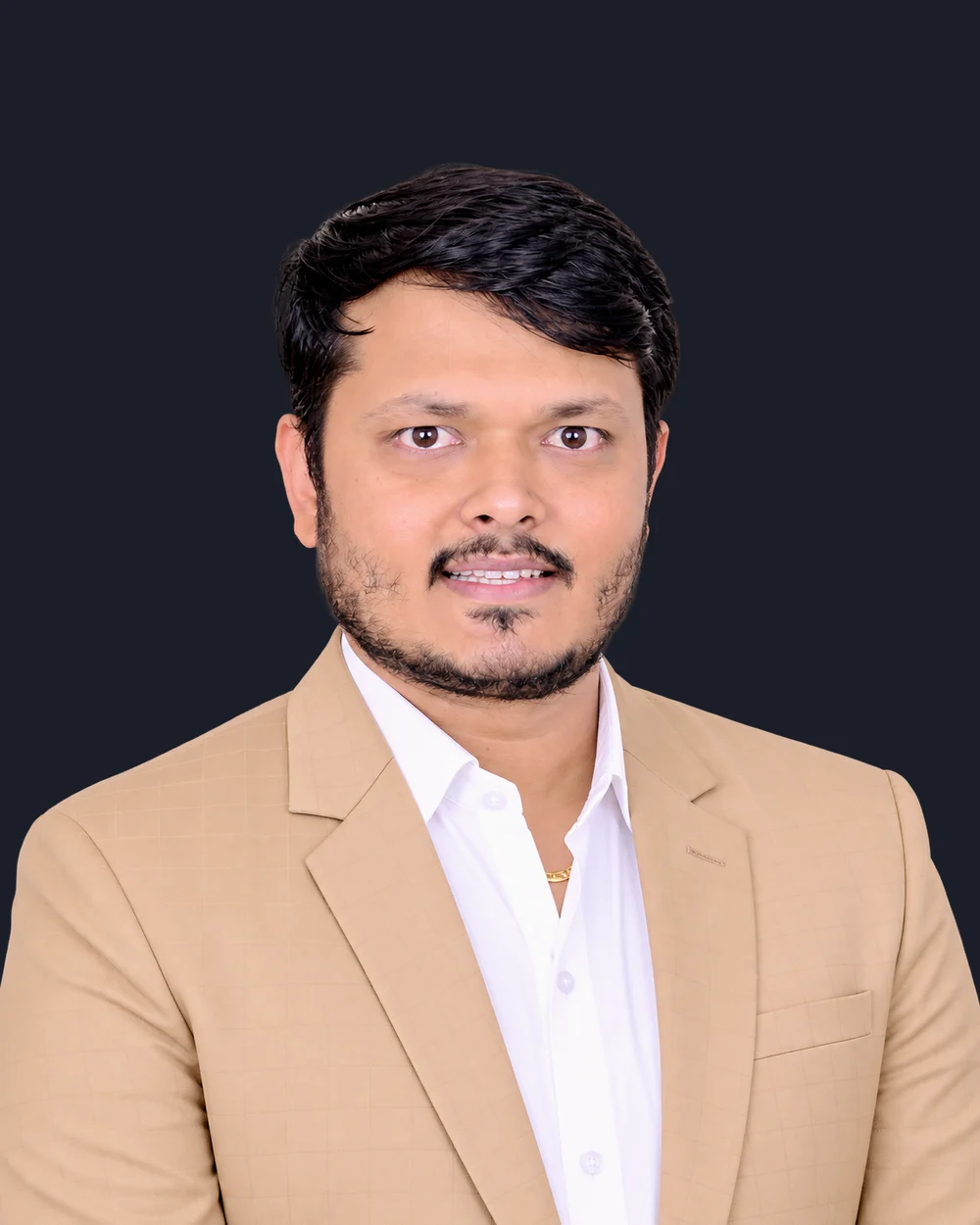 CA Devendra Kumar Jain, founder of Saramis Global, in a tan jacket.
